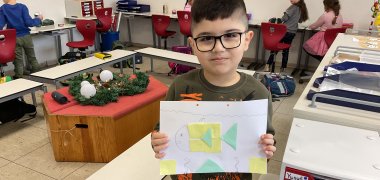 Boy shows his picture