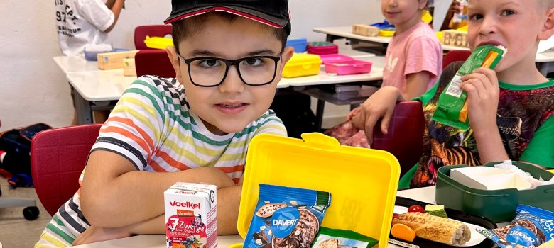 Boy shows his organic bread box